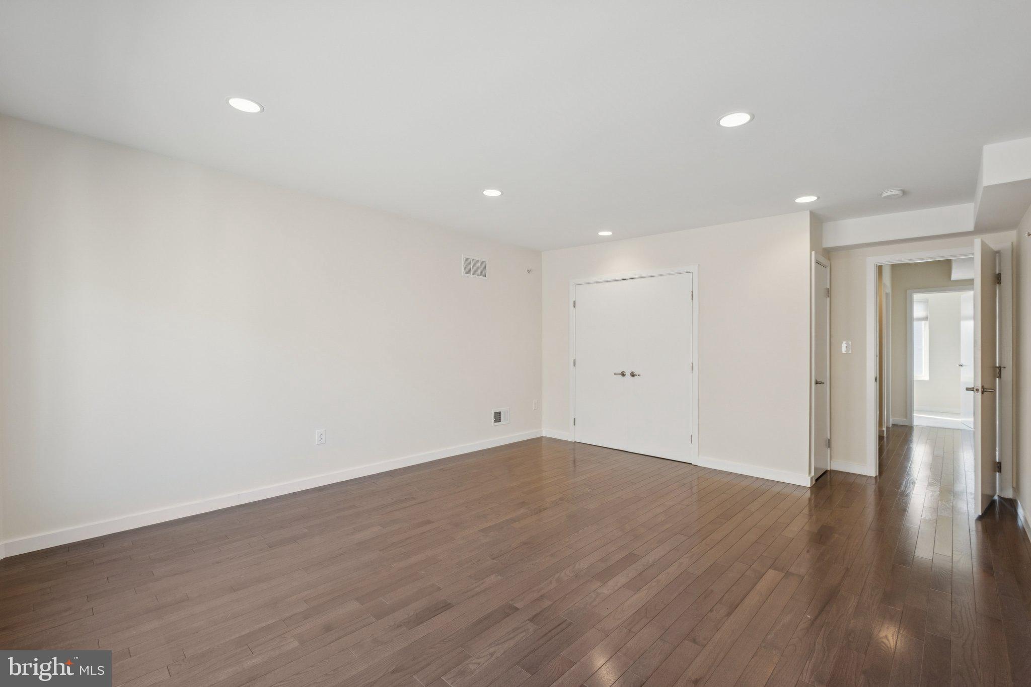 1189 South 21st Street Philadelphia, PA 19146 - Photo 14 of 30 a view of an empty room with wooden floor