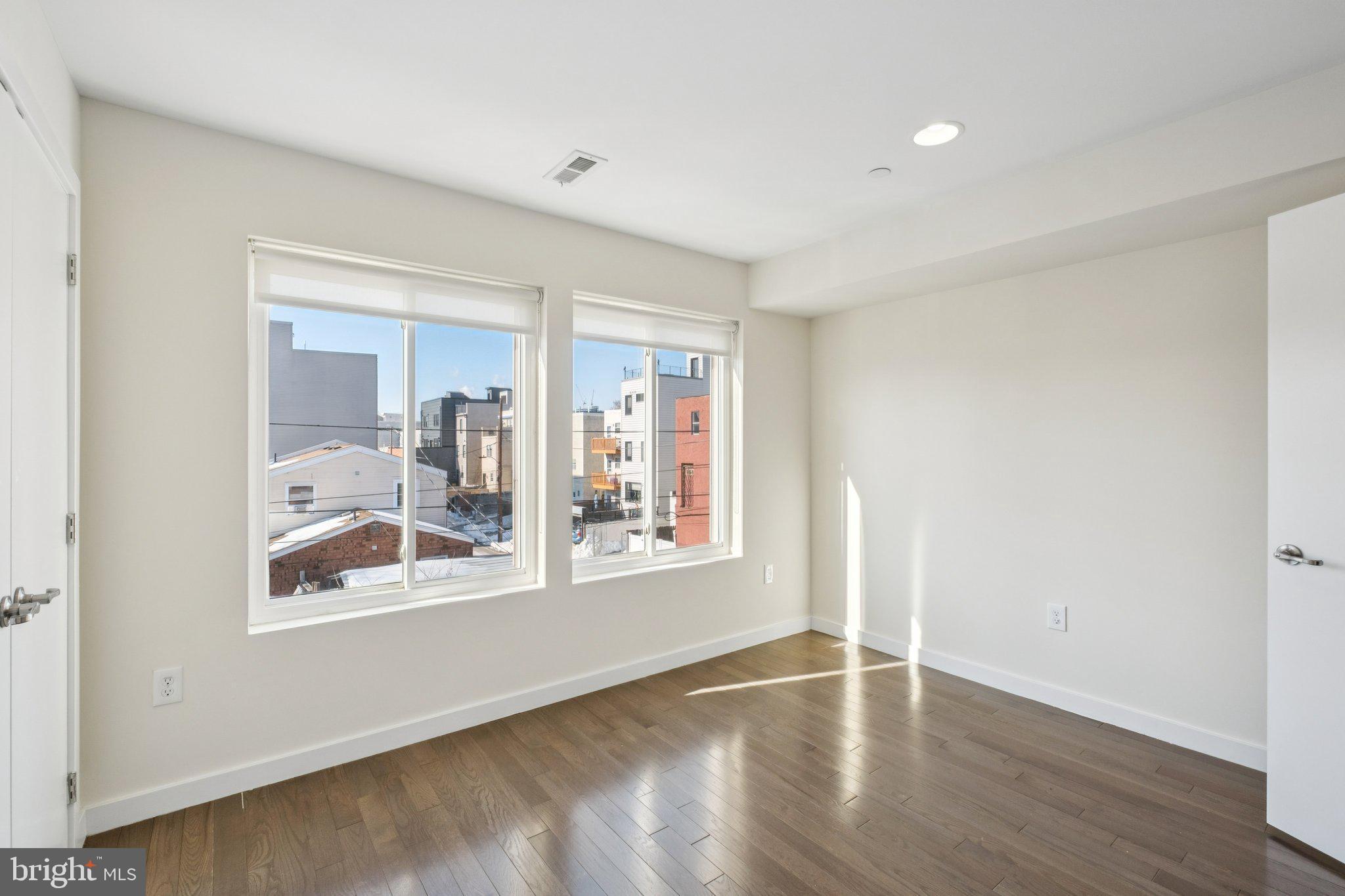 1189 South 21st Street Philadelphia, PA 19146 - Photo 16 of 30 a view of a big room with wooden floor and windows