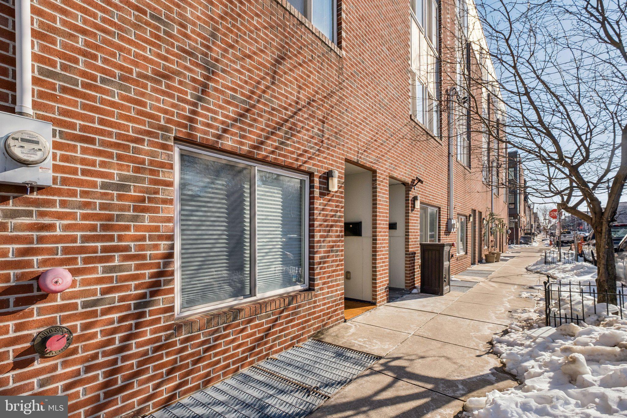 1189 South 21st Street Philadelphia, PA 19146 - Photo 2 of 30 a view of a brick house with a door
