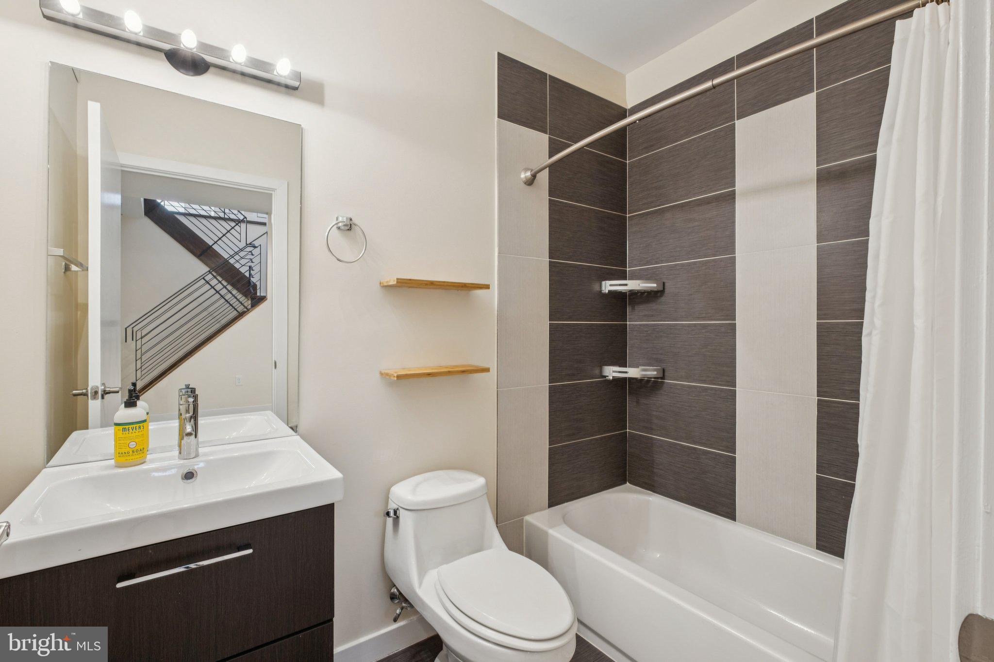 1189 South 21st Street Philadelphia, PA 19146 - Photo 24 of 30 a bathroom with a toilet a sink and shower