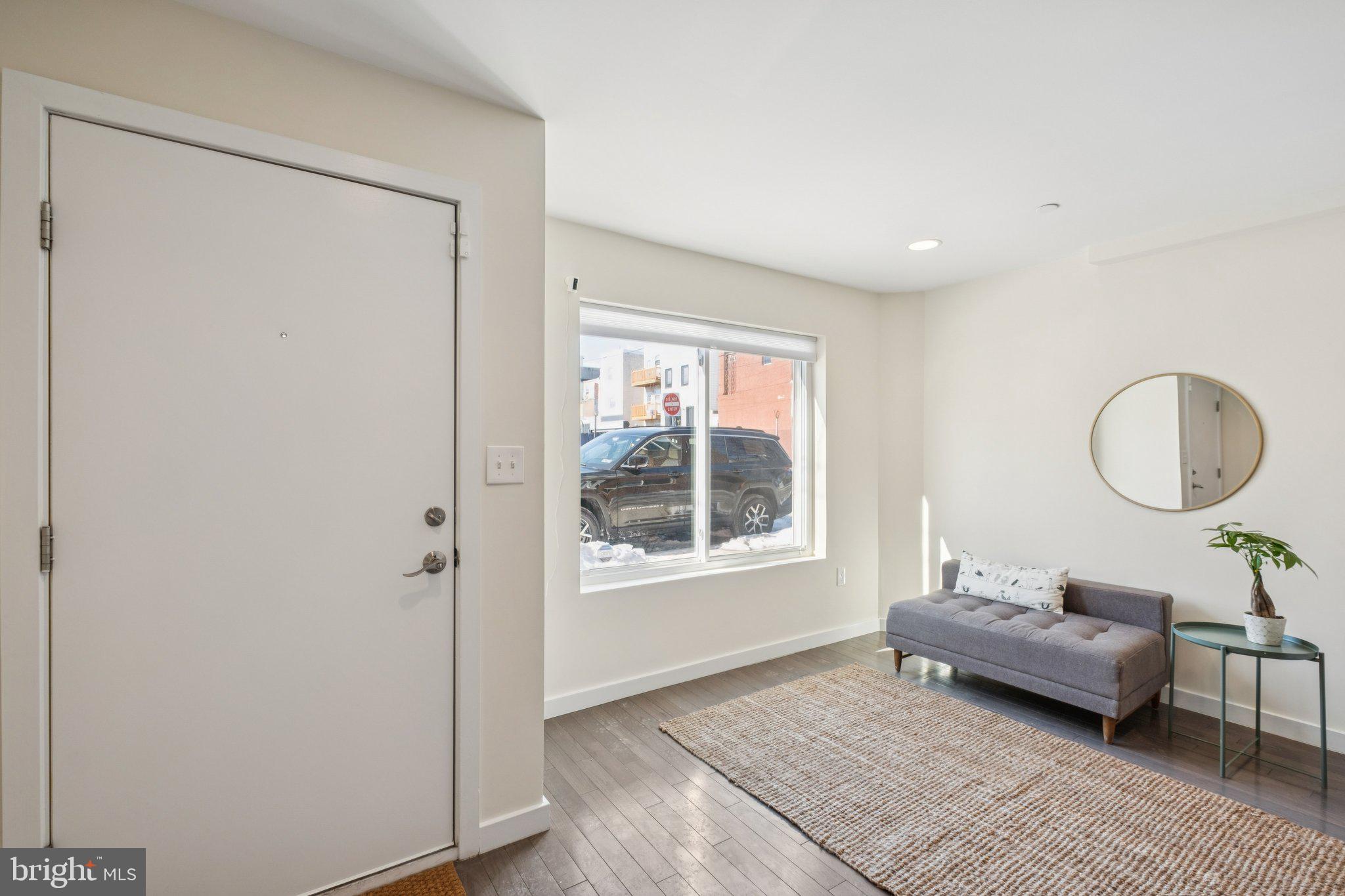 1189 South 21st Street Philadelphia, PA 19146 - Photo 4 of 30 a living room with furniture and a window