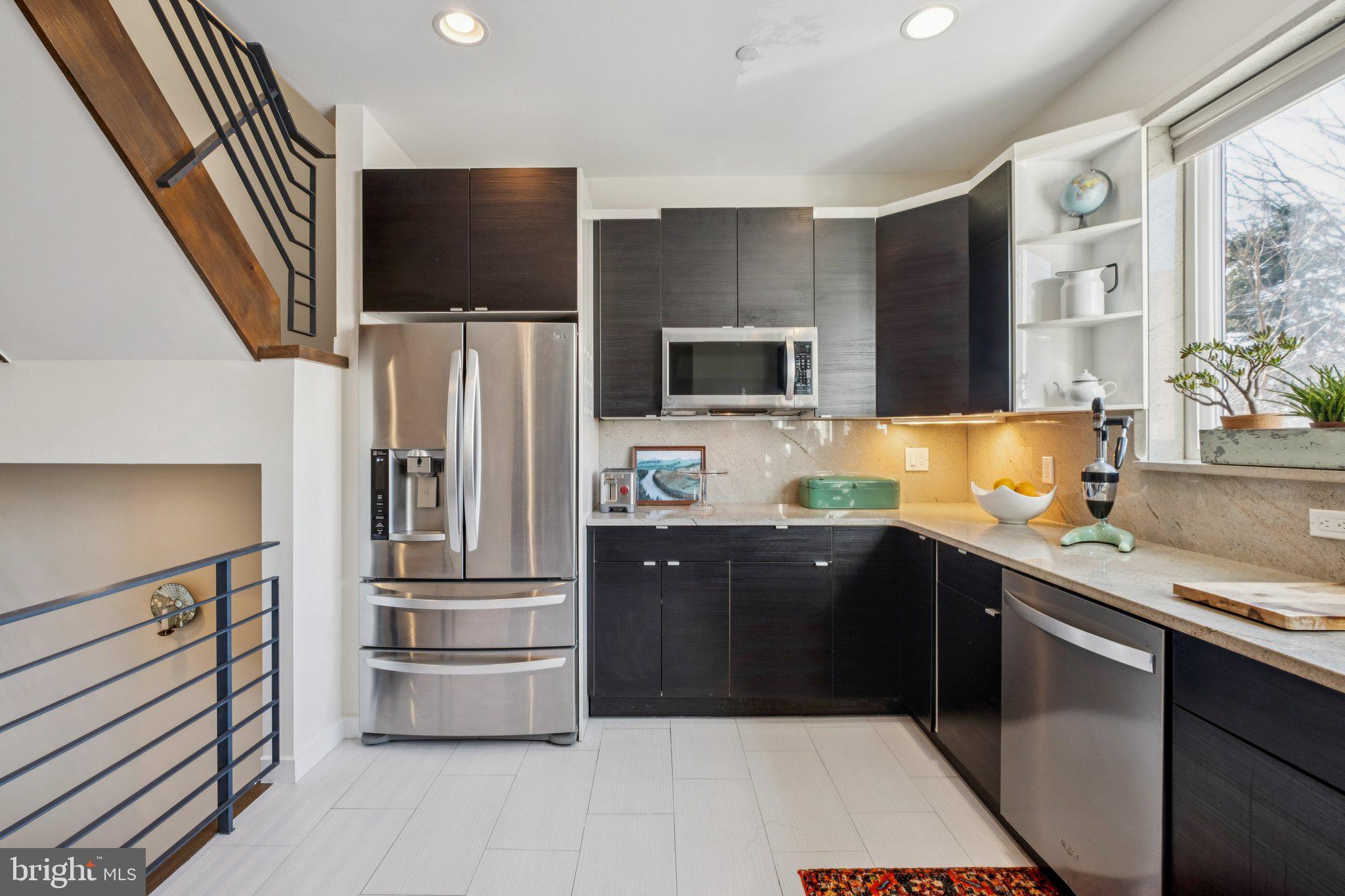 1189 South 21st Street Philadelphia, PA 19146 - Photo 7 of 30 a kitchen with stainless steel appliances cabinets and a counter top space