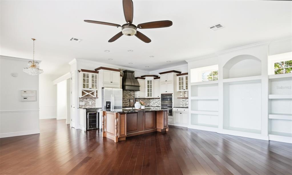 4495 Secretariat Run Spring Hill, FL 34609 - Photo 13 of 43 a view of a livingroom with furniture and wooden floor