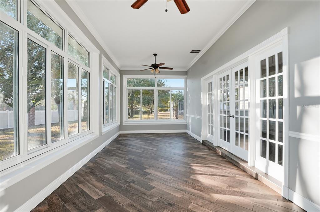 4495 Secretariat Run Spring Hill, FL 34609 - Photo 17 of 43 a view of an entryway with wooden floor and windows