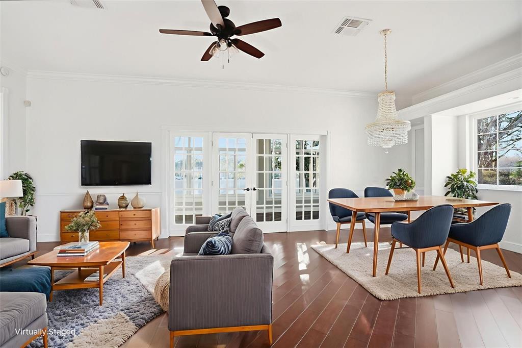 4495 Secretariat Run Spring Hill, FL 34609 - Photo 18 of 43 a living room with furniture a rug and a flat screen tv