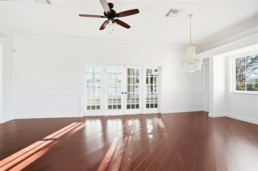 4495 Secretariat Run Spring Hill, FL 34609 - Photo 19 of 43 a view of a room with wooden floor closet and windows