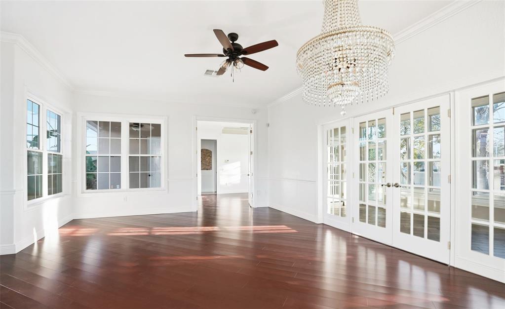 4495 Secretariat Run Spring Hill, FL 34609 - Photo 20 of 43 a view of an empty room with wooden floor and a window