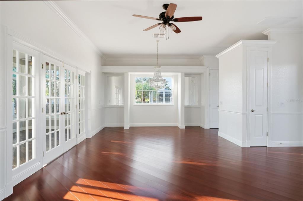 4495 Secretariat Run Spring Hill, FL 34609 - Photo 21 of 43 a view of empty room with wooden floor and fan