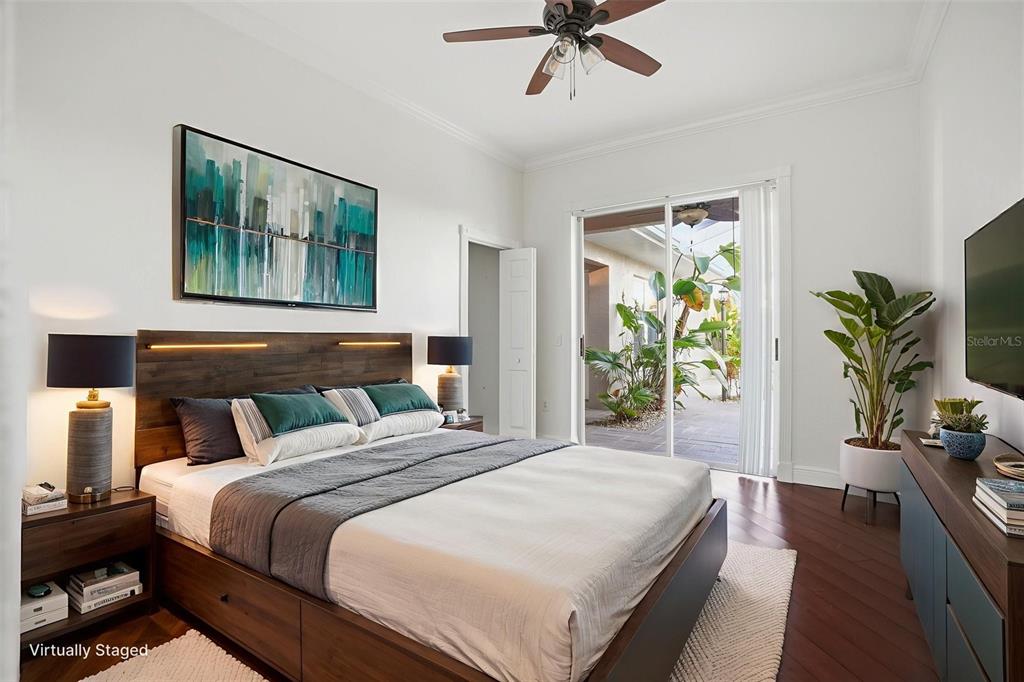 4495 Secretariat Run Spring Hill, FL 34609 - Photo 27 of 43 a bedroom with bed and glass window