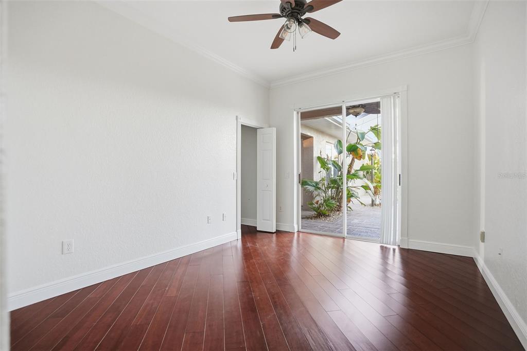 4495 Secretariat Run Spring Hill, FL 34609 - Photo 28 of 43 a view of an empty room with wooden floor and a window