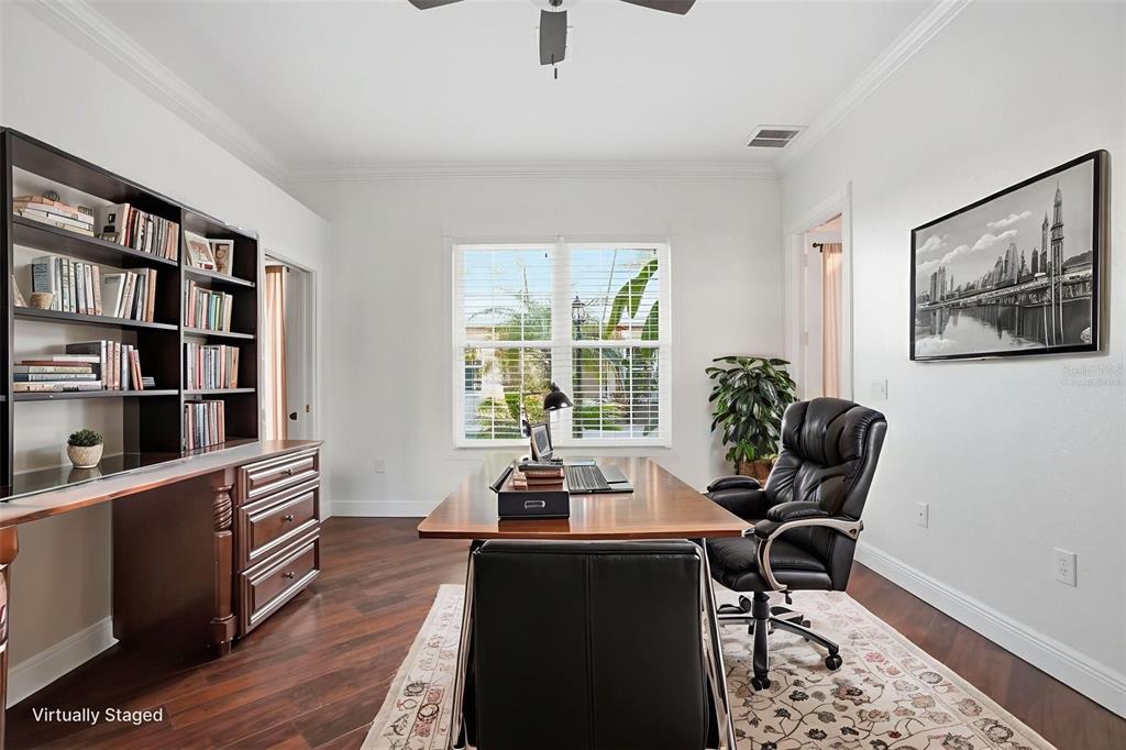 4495 Secretariat Run Spring Hill, FL 34609 - Photo 33 of 43 a view of a workspace with furniture and a window