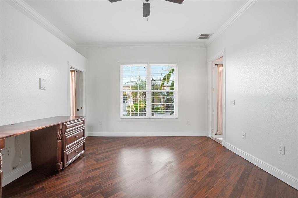 4495 Secretariat Run Spring Hill, FL 34609 - Photo 34 of 43 an empty room with wooden floor and windows