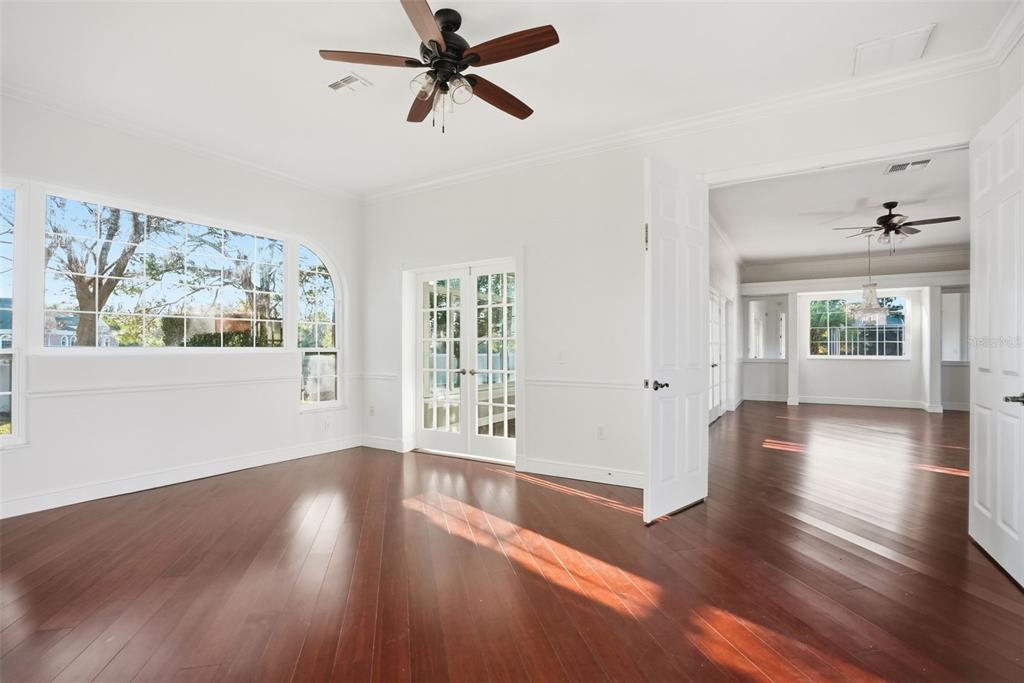 4495 Secretariat Run Spring Hill, FL 34609 - Photo 35 of 43 a view of empty room with wooden floor and fan