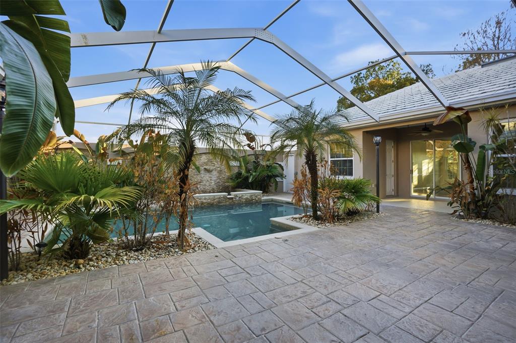 4495 Secretariat Run Spring Hill, FL 34609 - Photo 43 of 43 a view of a chairs and table in backyard of a house
