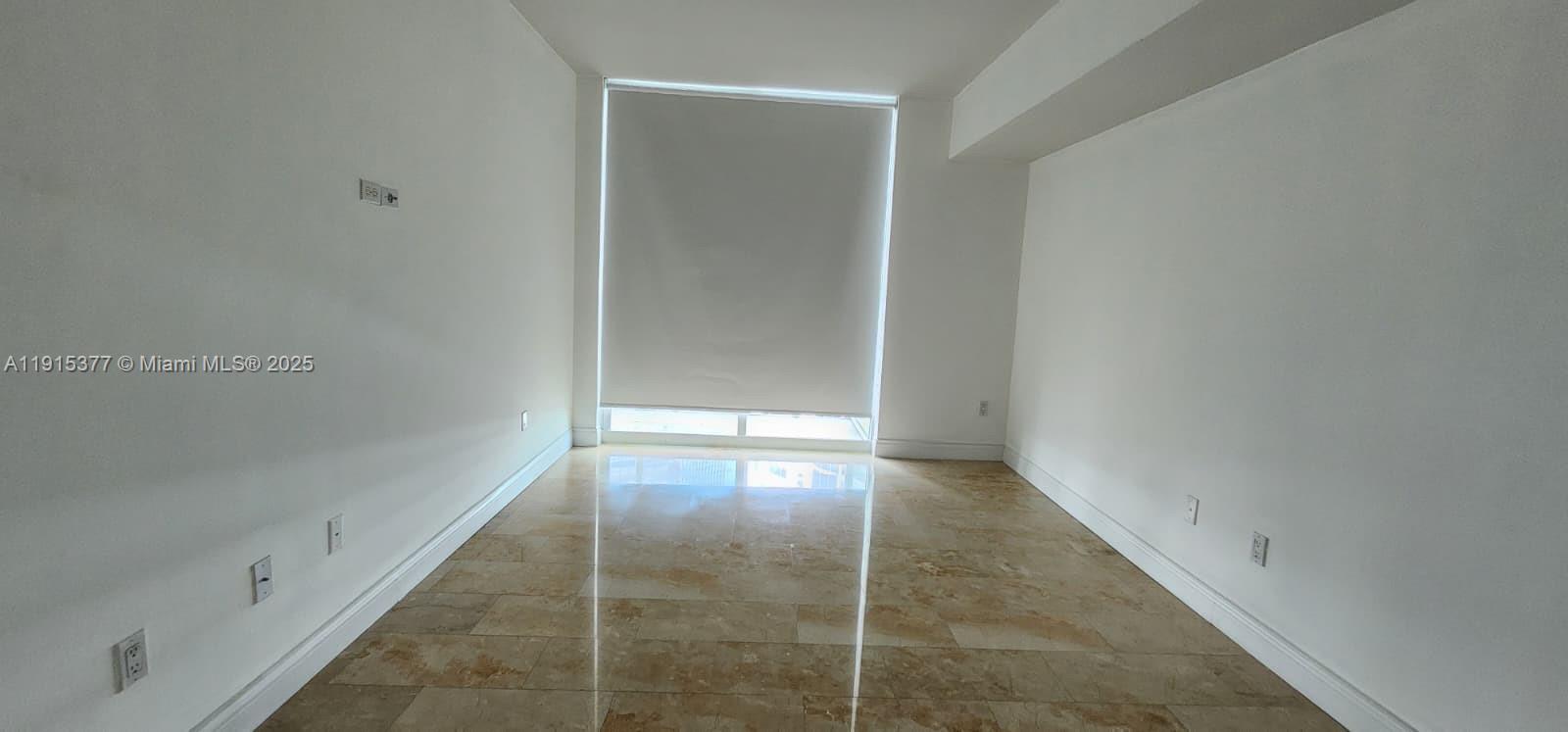 218 Southeast 14th Street, Unit 1904 Miami, FL 33131 - Photo 8 of 14 an empty room with windows