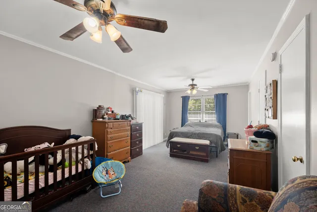 a bedroom with furniture and a window