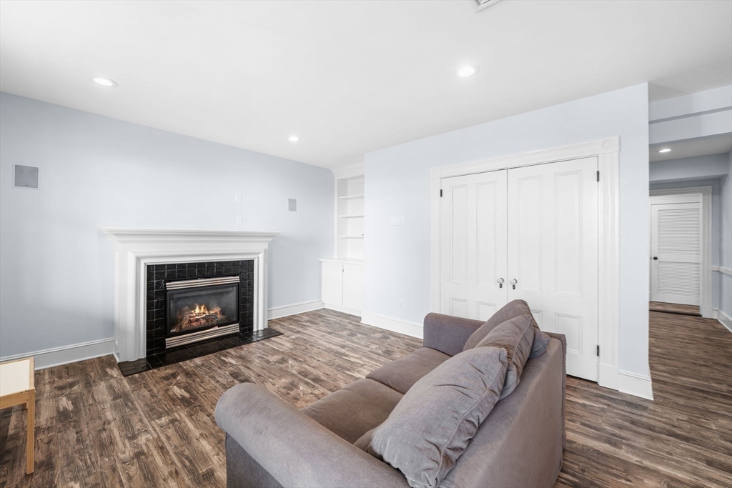 90 Puritan Road Swampscott, MA 01907 - Photo 34 of 42 a living room with furniture and a fireplace