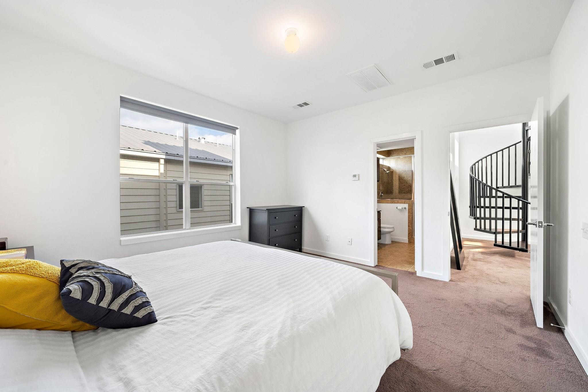 441 Meadow Street Houston, TX 77020 - Photo 13 of 20 a bedroom with a bed and a window