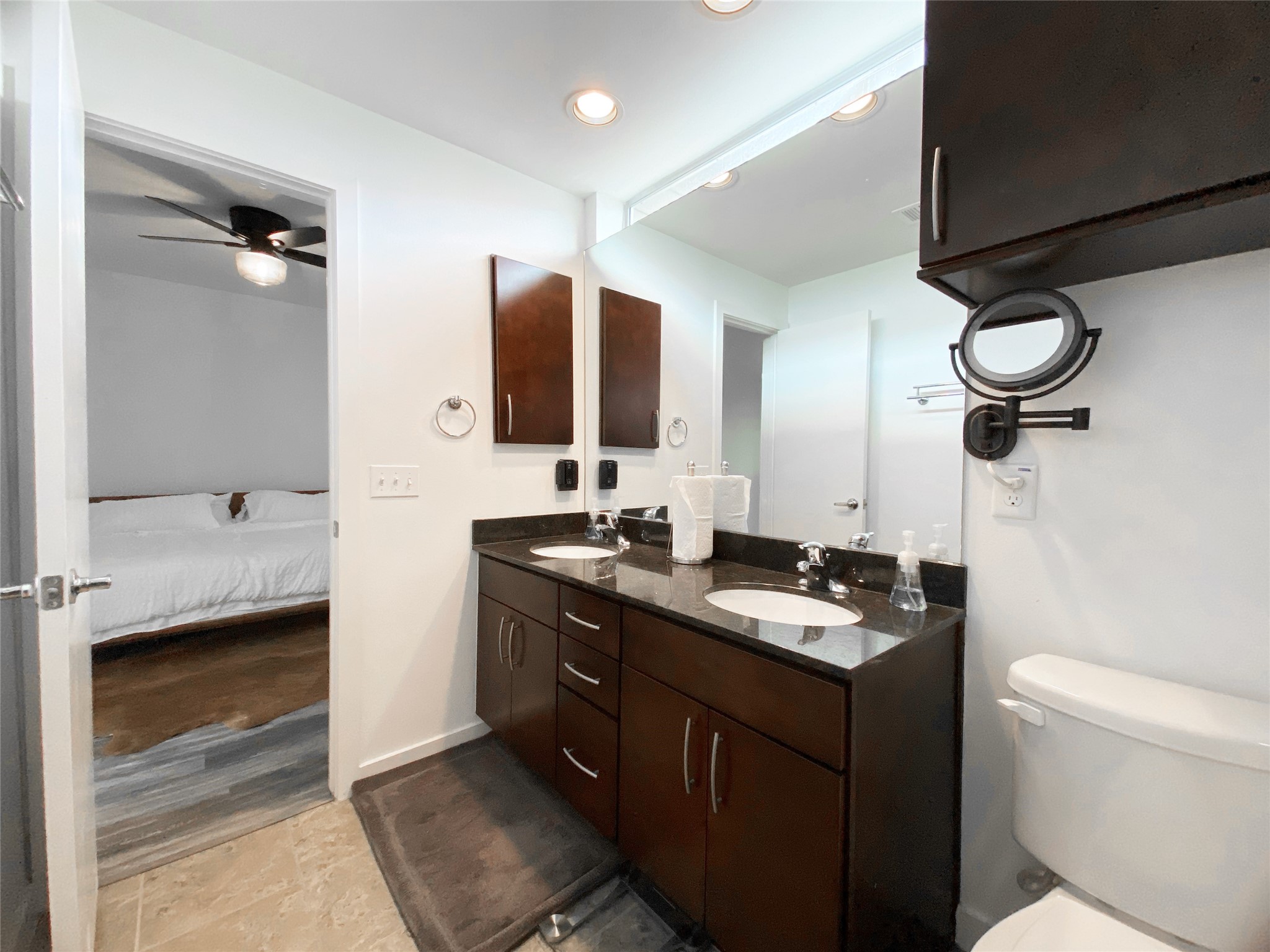441 Meadow Street Houston, TX 77020 - Photo 14 of 20 a bathroom with a double vanity sink a mirror and a toilet