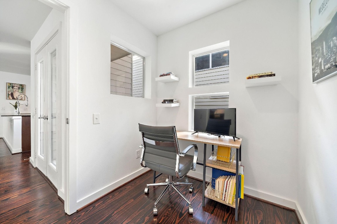 441 Meadow Street Houston, TX 77020 - Photo 16 of 20 a workspace with wooden floor and a window