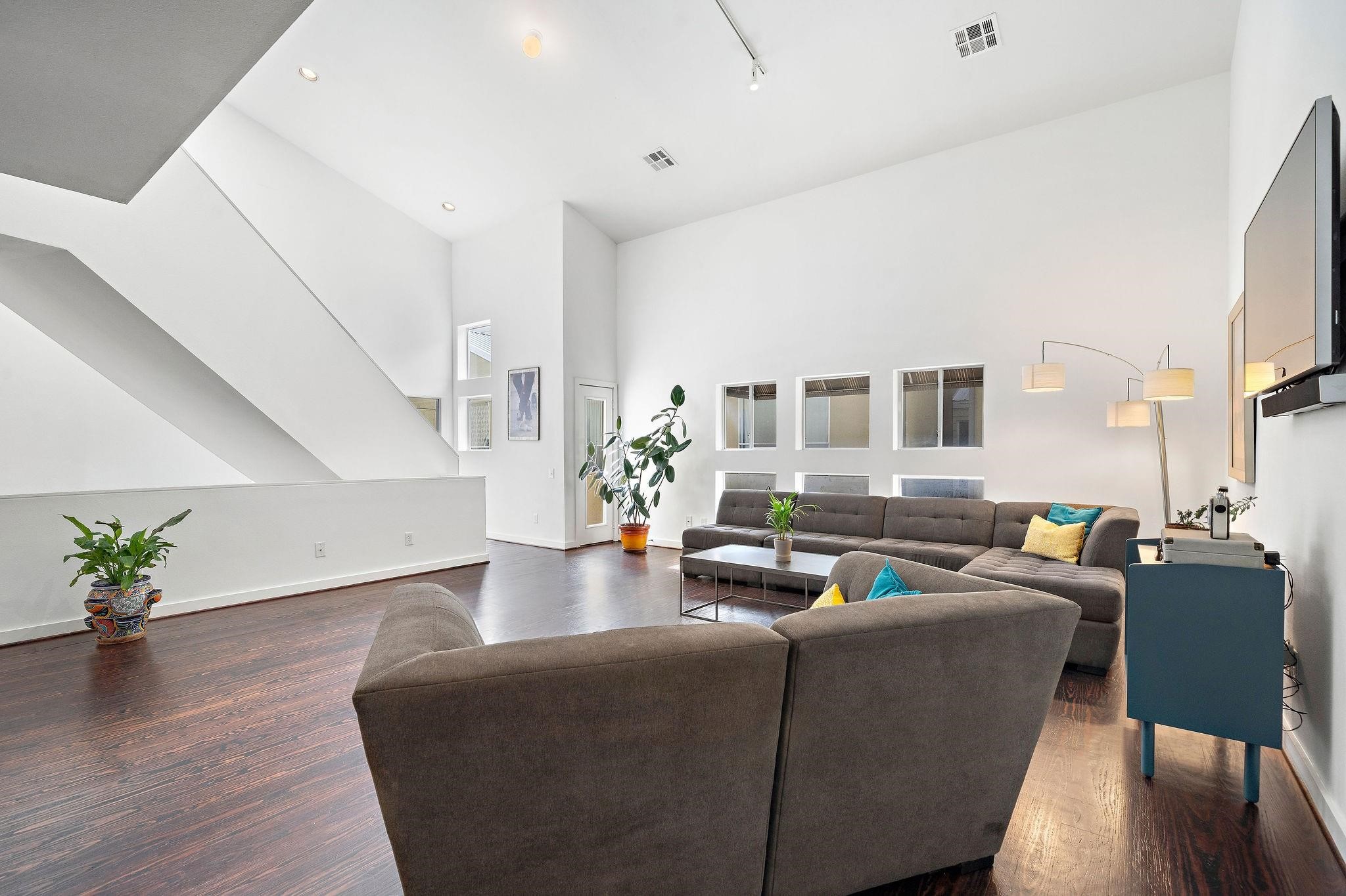 441 Meadow Street Houston, TX 77020 - Photo 5 of 20 a living room with fireplace furniture and a wooden floor