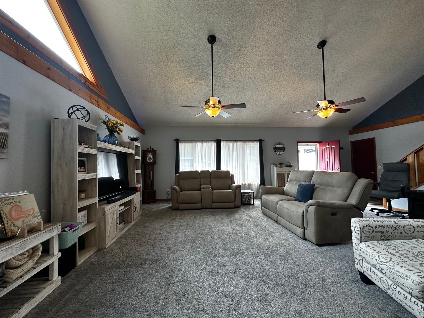 4100 416 North Clinton, IL 61727 - Photo 12 of 33 a living room with furniture a flat screen tv and a window