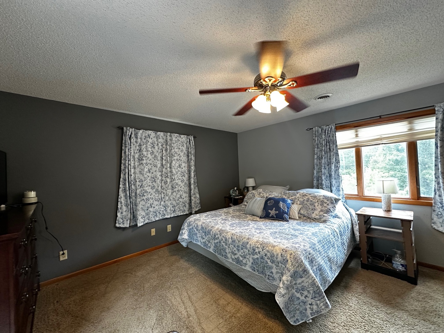 4100 416 North Clinton, IL 61727 - Photo 23 of 33 a bedroom with a bed and a chandelier