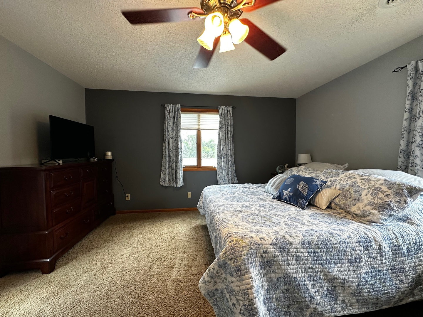 4100 416 North Clinton, IL 61727 - Photo 24 of 33 a bedroom with a bed and a flat screen tv