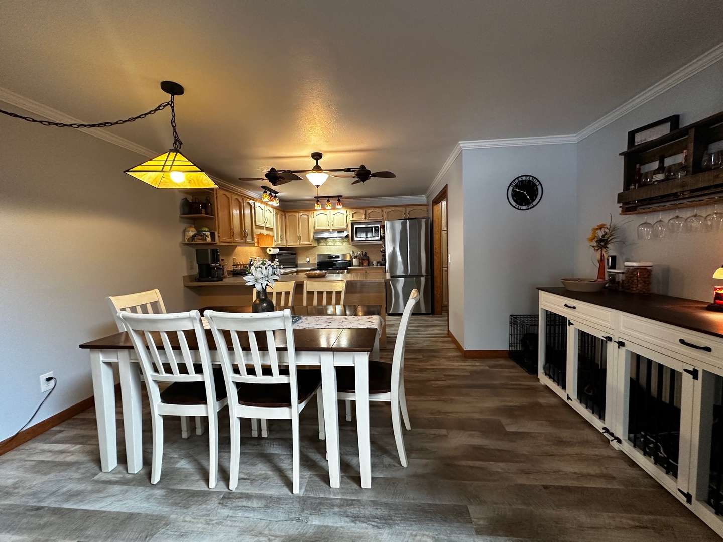 4100 416 North Clinton, IL 61727 - Photo 10 of 33 a view of a dining room with furniture wooden floor and chandelier