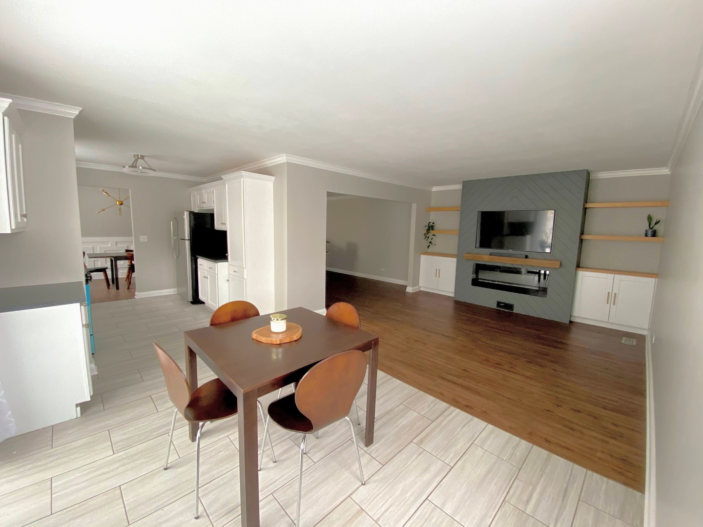 1214 Needham Road Naperville, IL 60563 - Photo 11 of 25 a living room with furniture and a wooden floor