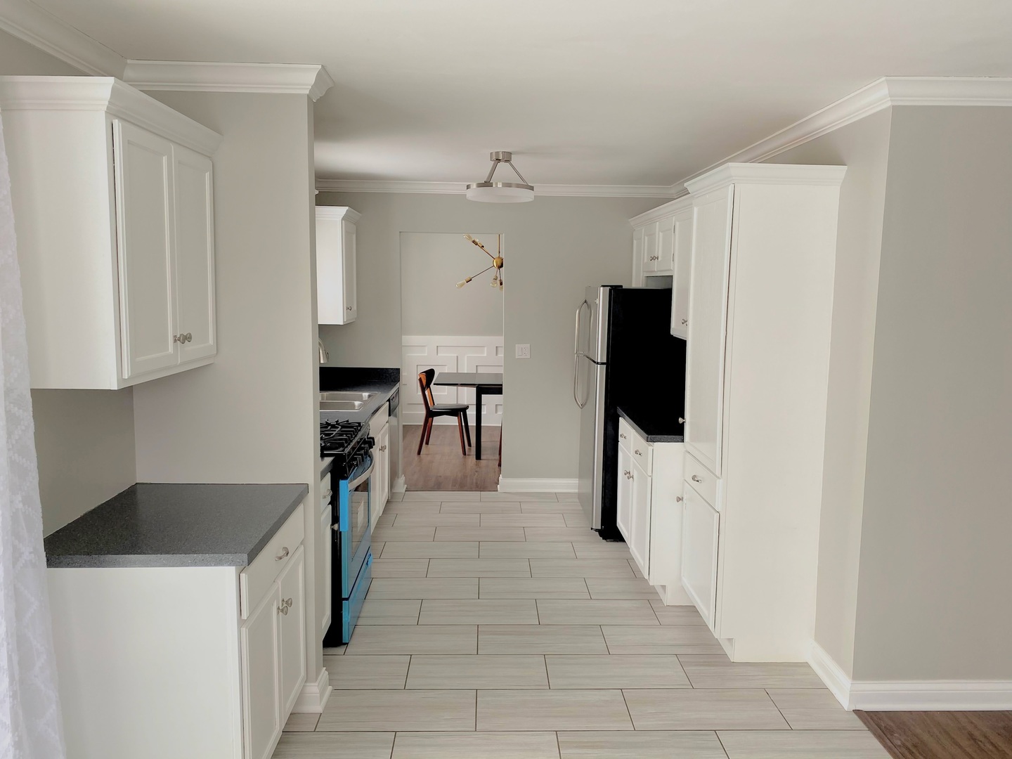 1214 Needham Road Naperville, IL 60563 - Photo 13 of 25 a kitchen with stainless steel appliances a refrigerator and a stove