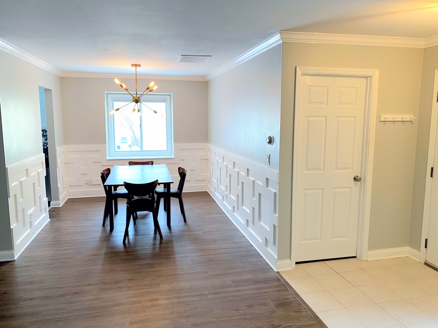 1214 Needham Road Naperville, IL 60563 - Photo 4 of 25 a view of a dining room with furniture and wooden floor