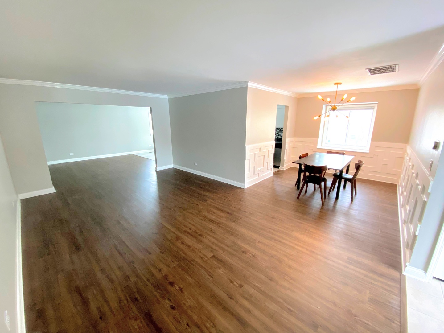 1214 Needham Road Naperville, IL 60563 - Photo 6 of 25 a view of a dining room with furniture and wooden floor