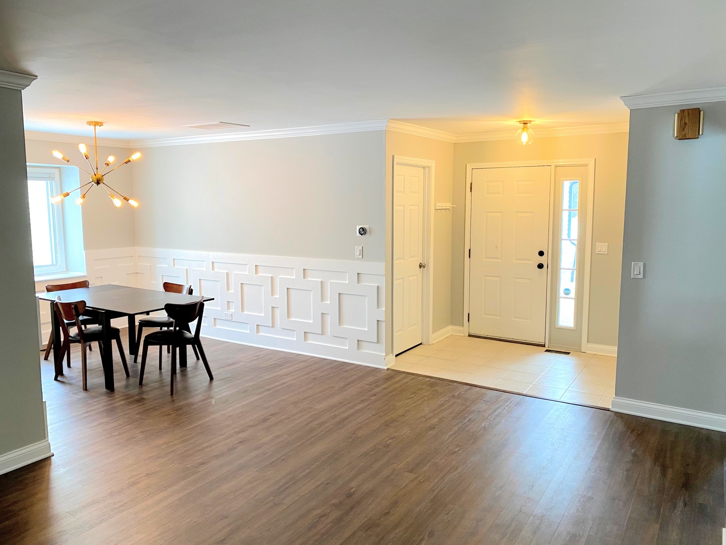 1214 Needham Road Naperville, IL 60563 - Photo 7 of 25 a view of a dining room with furniture and wooden floor