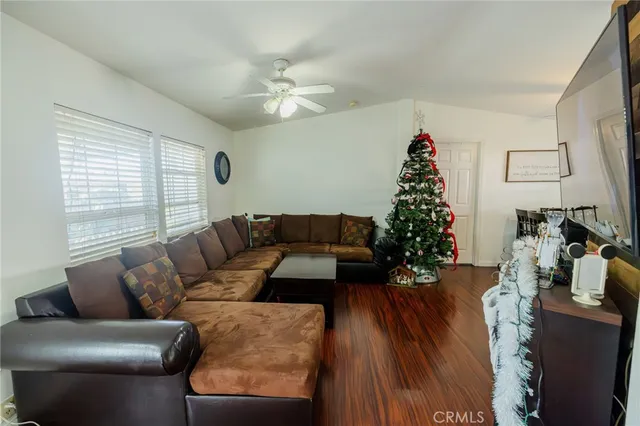 a living room with furniture and a christmas tree
