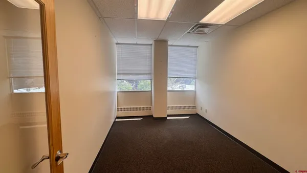 a view of a room with yard from a window