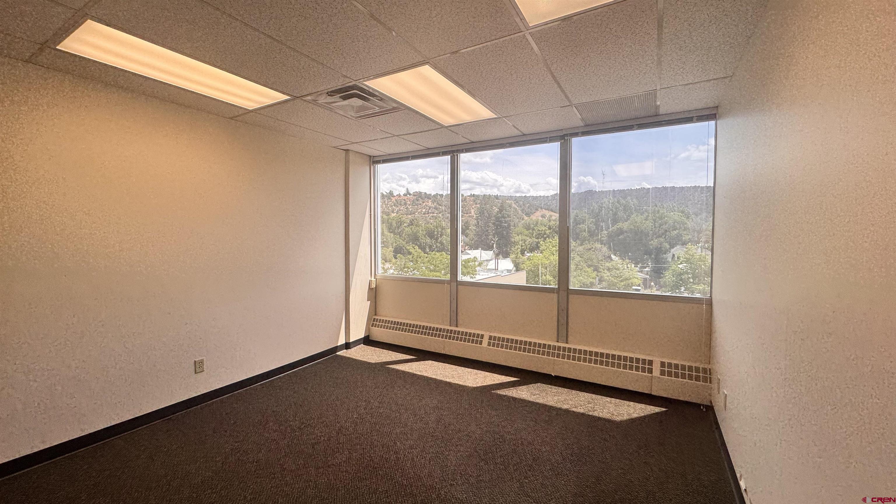 835 East 2nd Avenue, Unit 400 Durango, CO 81301 - Photo 5 of 20 a view of an empty room with a window