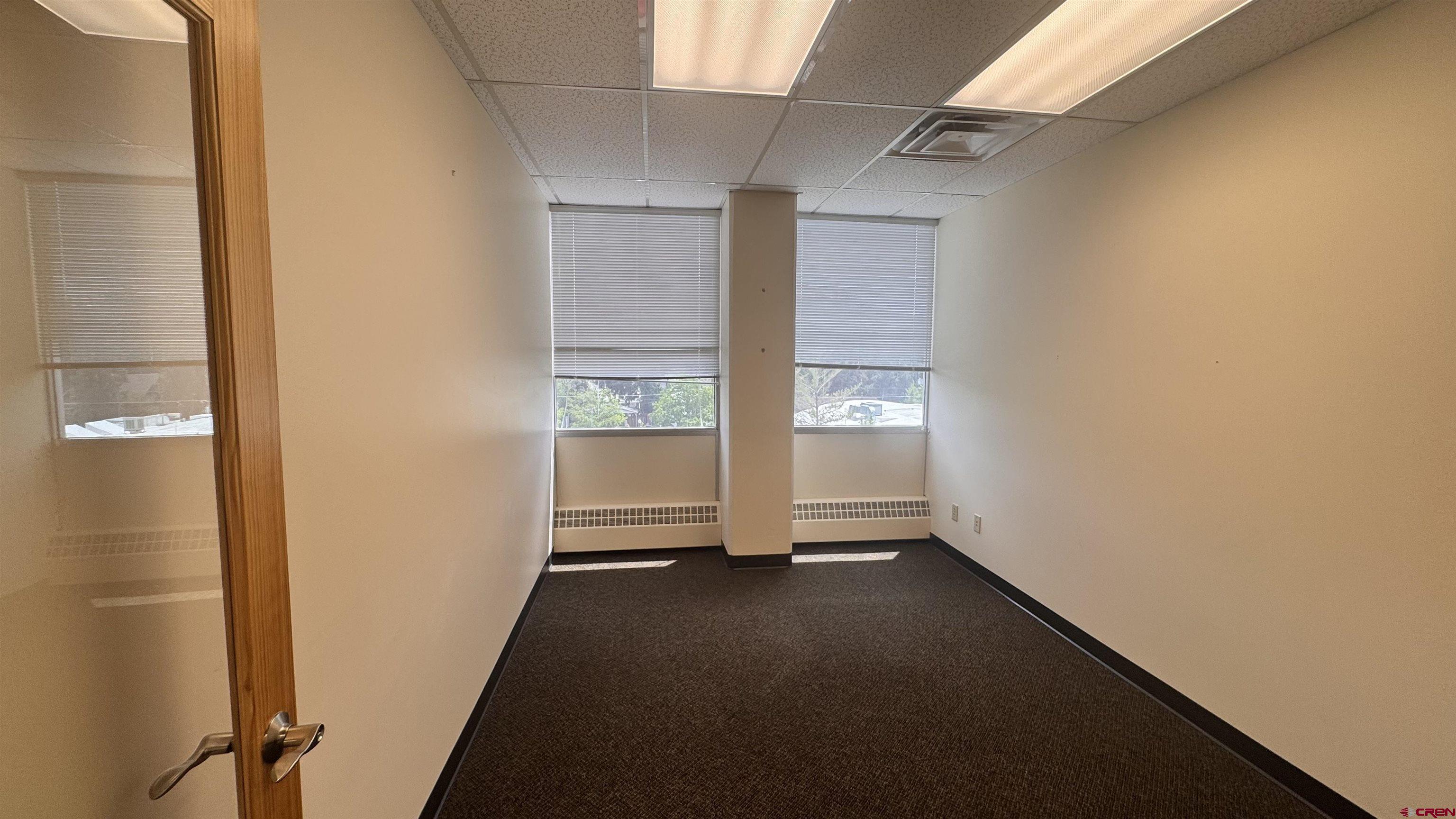 835 East 2nd Avenue, Unit 400 Durango, CO 81301 - Photo 6 of 20 an empty room with windows