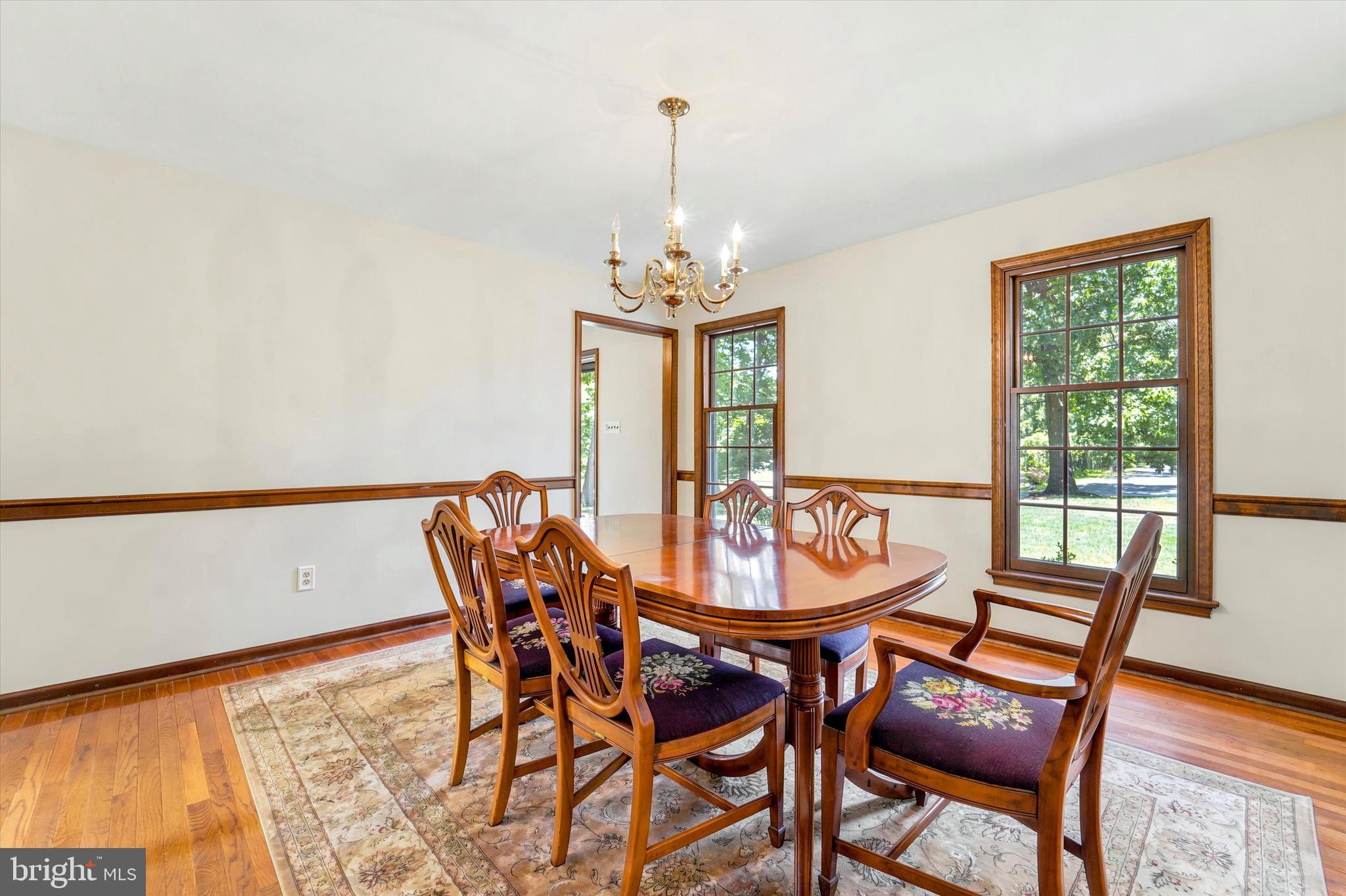 1980 Terwood Road Huntingdon Valley, PA 19006 - Photo 15 of 48 a dining room with furniture a chandelier and wooden floor