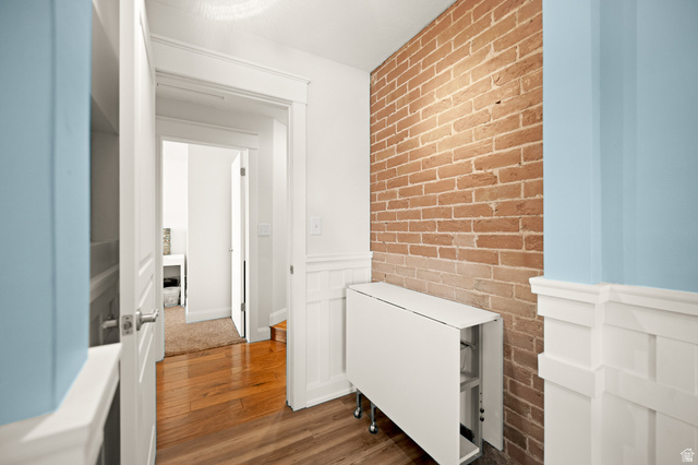 236 West 300 South Hurricane, UT 84737 - Photo 39 of 76 Exposed brick accent wall complemented by wainscoting and light blue painted walls