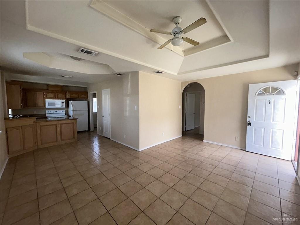 1803 Douglas, Unit 3 Pharr, TX 78577 - Photo 3 of 11 a view of a livingroom with a furniture wooden floor and a ceiling fan
