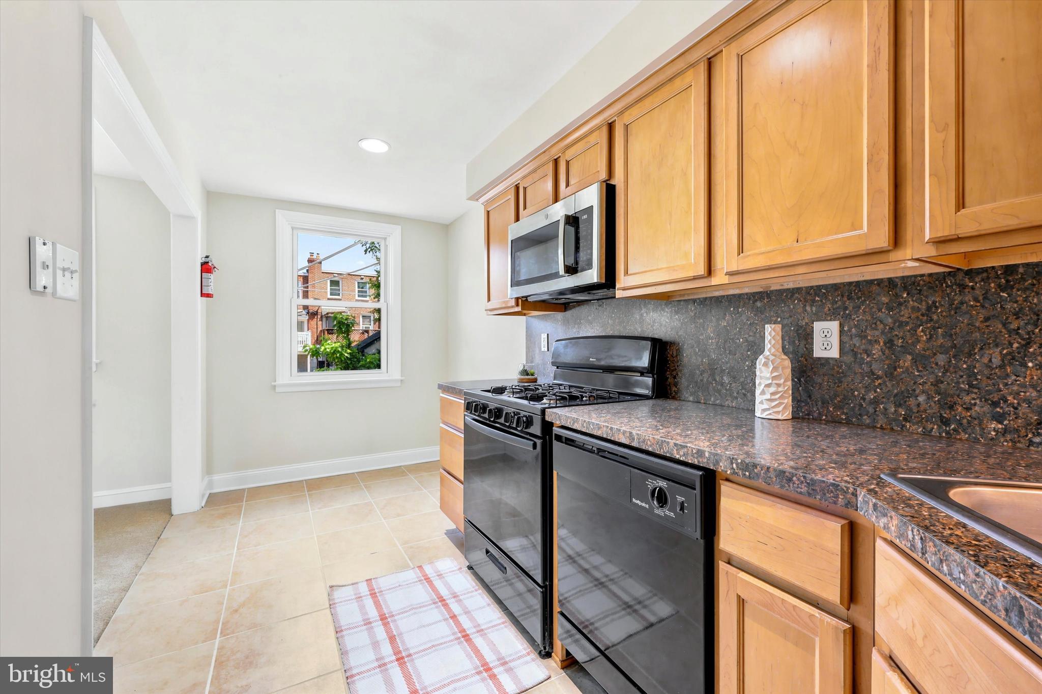 1129 Stratford Road Glenolden, PA 19036 - Photo 9 of 25 Eat-In Kitchen w/warm tones with Ceramic Floor