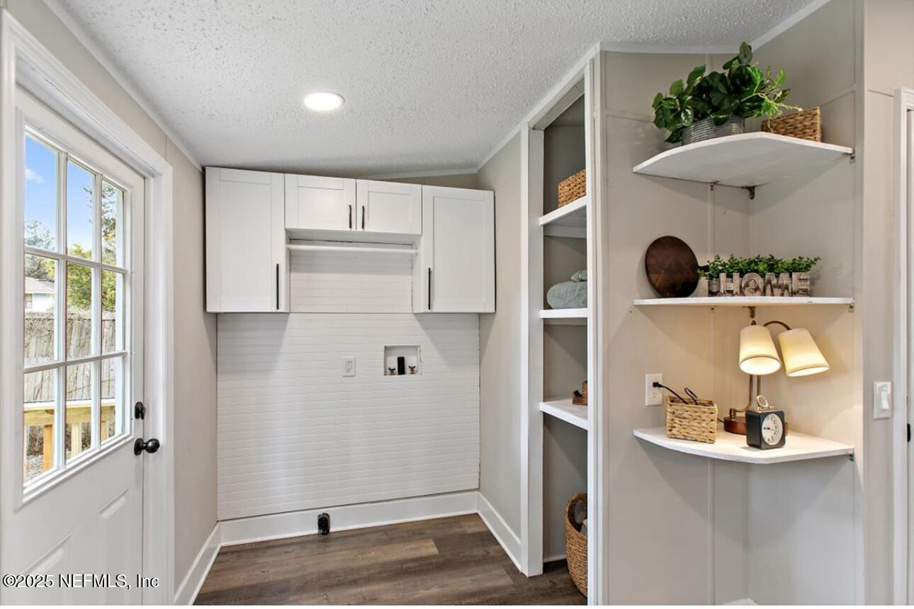 3032 Snell Street Jacksonville, FL 32218 - Photo 13 of 17 an empty room with windows and wardrobe