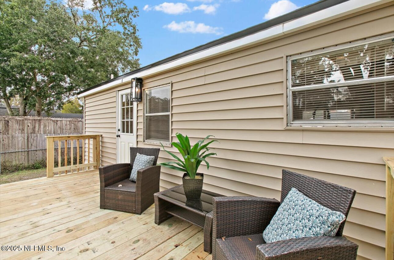 3032 Snell Street Jacksonville, FL 32218 - Photo 15 of 17 a balcony with table and chairs