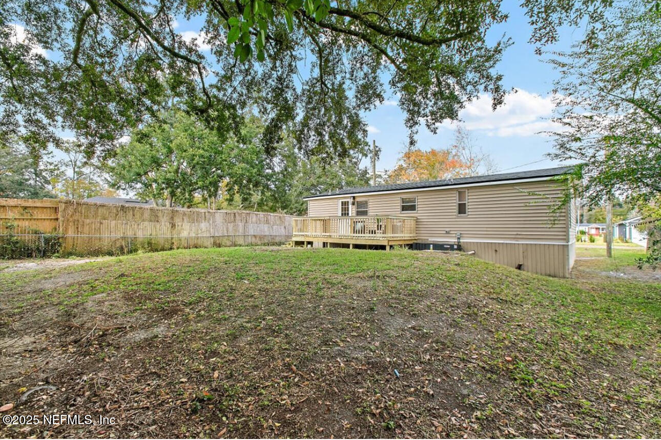 3032 Snell Street Jacksonville, FL 32218 - Photo 17 of 17 a view of a backyard with a small cabin