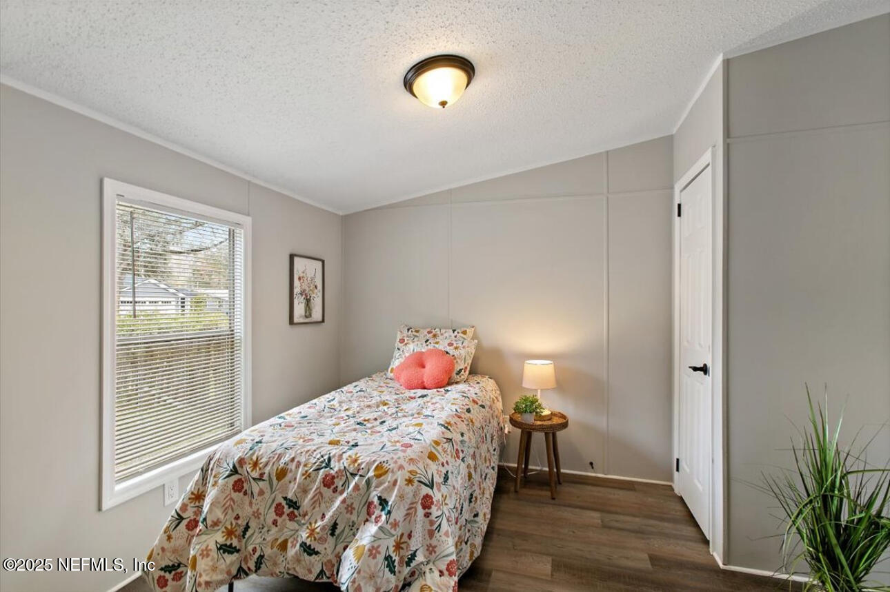 3032 Snell Street Jacksonville, FL 32218 - Photo 10 of 17 a bedroom with bed and a window