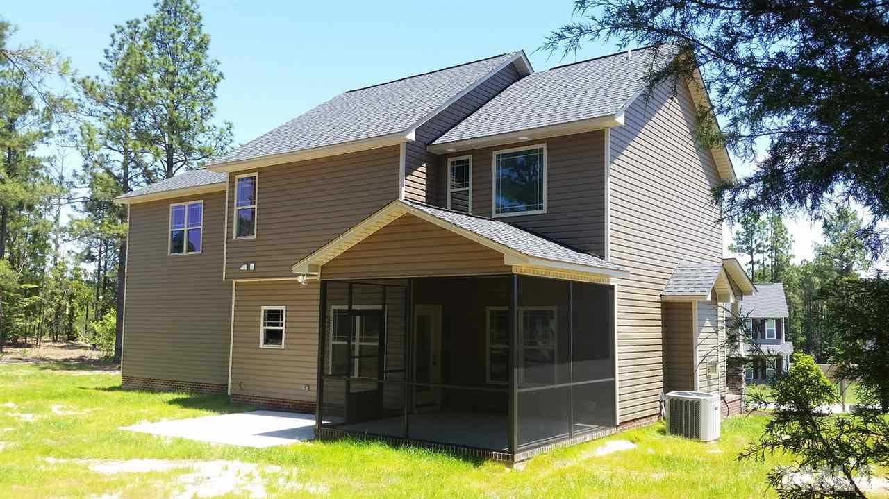 219 Spring Flowers Drive Cameron, NC 28326 - Photo 2 of 12 a view of a house with a yard