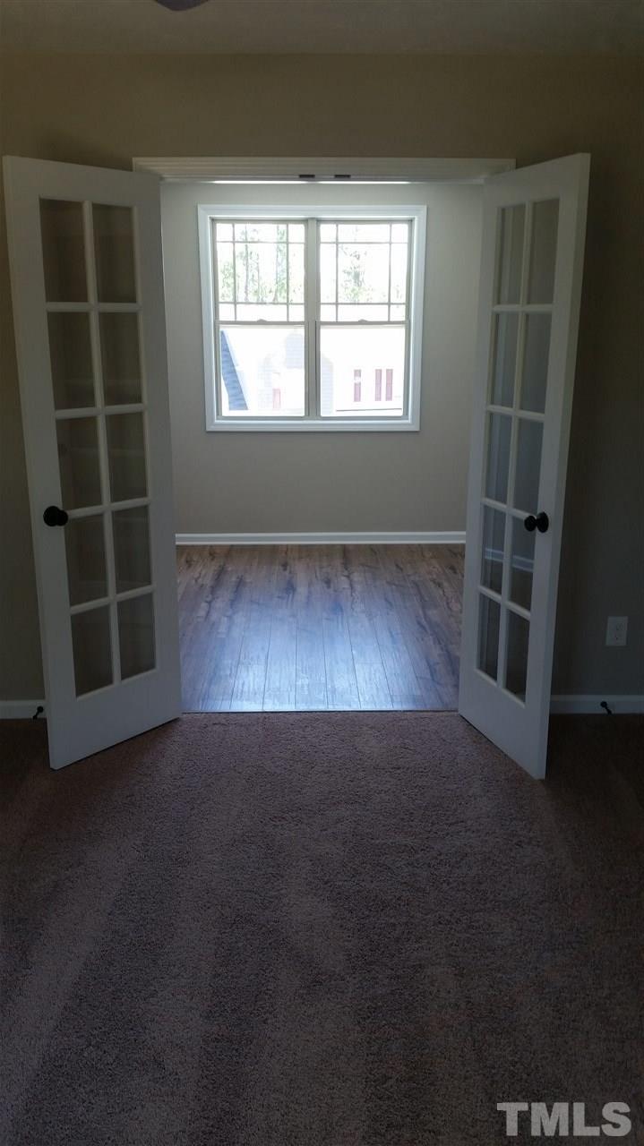 219 Spring Flowers Drive Cameron, NC 28326 - Photo 11 of 12 an empty room with windows