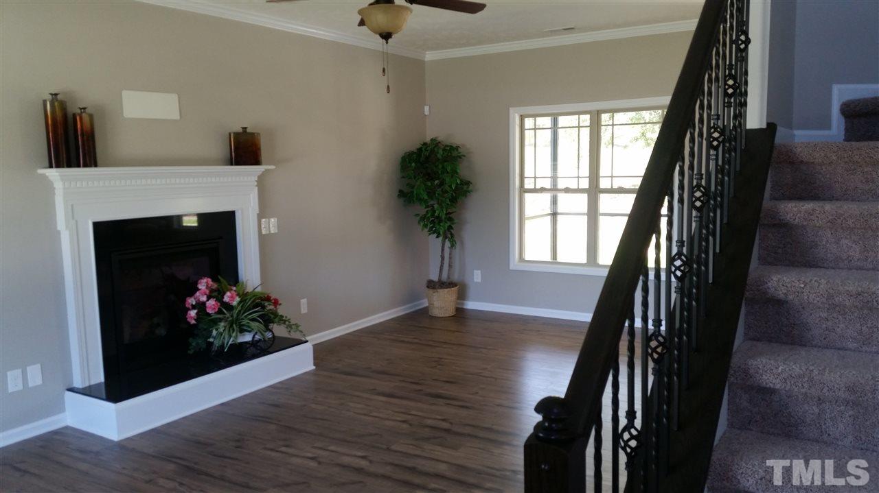 219 Spring Flowers Drive Cameron, NC 28326 - Photo 3 of 12 a living room with furniture and a fireplace