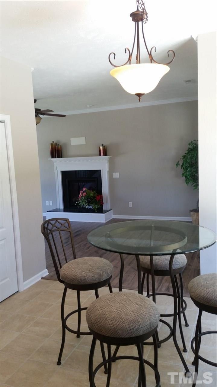 219 Spring Flowers Drive Cameron, NC 28326 - Photo 6 of 12 a living room with furniture and a fireplace